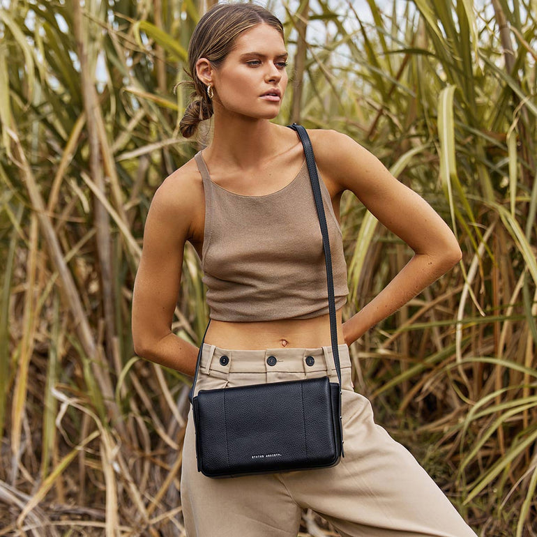 Succumb Women's Black Leather Crossbody Bag | Status Anxiety®